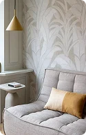 A leafy patterned wallpaper.