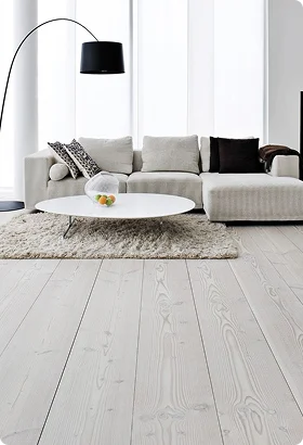 A modern living room featuring a light sofa