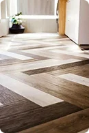 A modern wooden floor with a chevron pattern