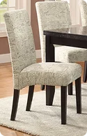 A patterned fabric dining chair with dark wooden legs