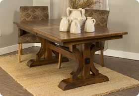 A rustic wooden dining table with decorative pottery