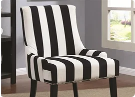 A stylish armchair featuring bold black and white vertical stripes