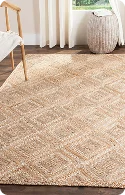 A textured, neutral-colored area rug with a geometric pattern