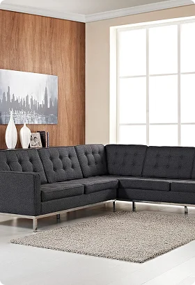 Modern gray sectional sofa with tufted cushions