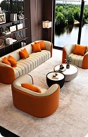 Modern living room featuring a curved sofa and chairs in cream and orange hues