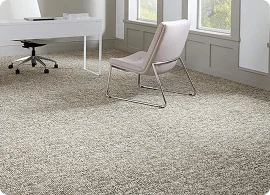Modern office space featuring a plush, patterned carpet