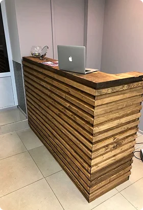 Modern wooden reception desk with horizontal slats