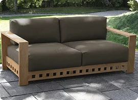 Stylish outdoor sofa with a wooden frame and dark cushions