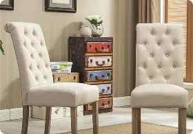 Two elegant cream-colored upholstered chairs