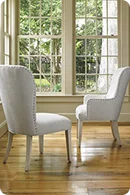 Two elegant white upholstered chairs