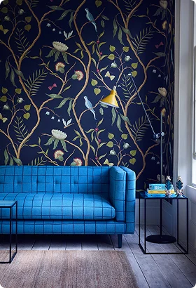 Vibrant living room featuring a blue tufted sofa