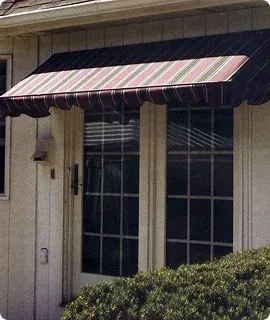 A striped awning in maroon and beige covers