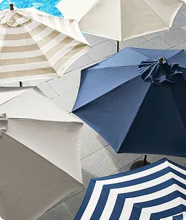 Aerial view of various beach umbrellas in cream