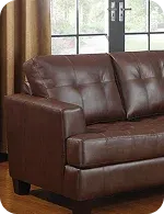 Brown leather sofa with a tufted design