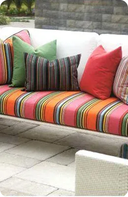 Colorful outdoor couch adorned with striped cushions