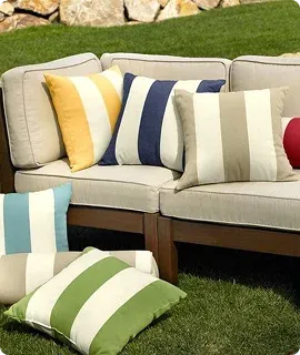 A cozy outdoor seating area with a light sofa