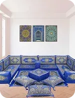 A vibrant blue lounge area with intricately patterned cushions