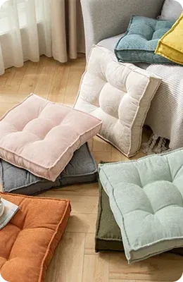 Colorful cushions arranged on a wooden floor