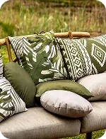 Couch with various patterned and colored pillows