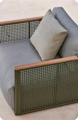 Gray cushioned chair with wooden and woven sides
