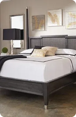 Modern bedroom featuring a stylish bed with gray wood frame