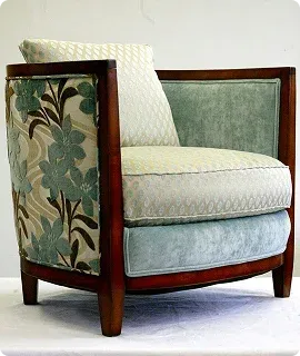 Stylish upholstered armchair with a wooden frame
