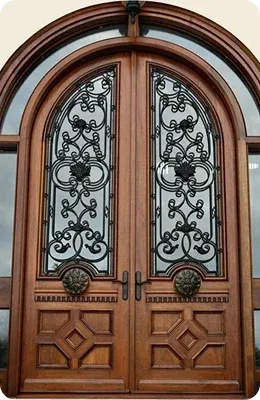 Wooden double doors with decorative ironwork